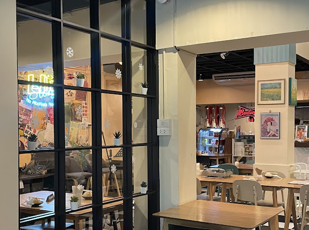 LIB STORY restaurant interior with black framed windows